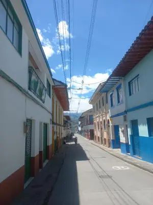 an empty alley with colorful buildings on a street at Alojamiento Betina in Salamina