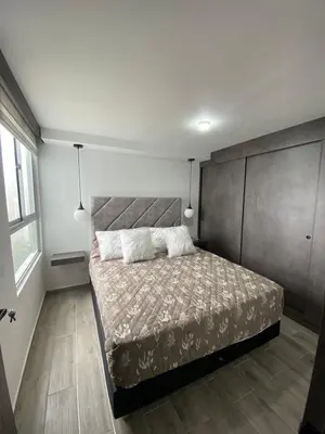 a bedroom with a large bed with two pillows at Modern APT Manizales in Manizales