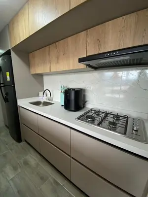 a kitchen with a stove and a sink at Modern APT Manizales in Manizales