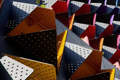 a wall of different colored and patterned boxes at Calle Flora Hotel by Jalo in Medellín
