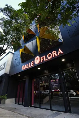a building with a sign that reads sale florarma at Calle Flora Hotel by Jalo in Medellín