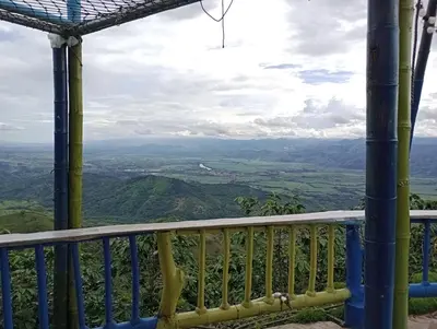 a view from the balcony of a mountain house at Cabaña Villa Lucía in El Madroño