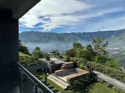 a set of stairs with a view of mountains at Aurora Ecoliving Finca a 30 minutos de Medellín in Girardota