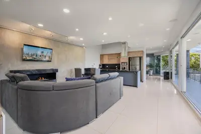a living room with a couch and a fireplace at Aurora Ecoliving Finca a 30 minutos de Medellín in Girardota
