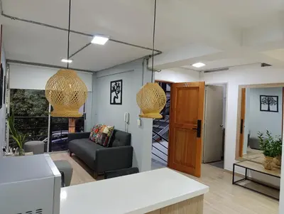 a living room with a couch and a table at Apartahotel Provenza 2 in Medellín