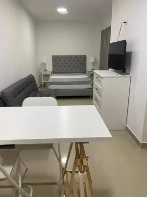 a living room with a couch and a table at Apartahotel Provenza 2 in Medellín