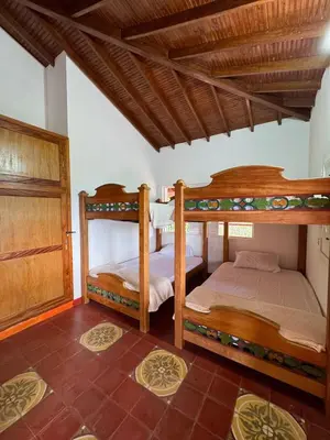 a bedroom with two bunk beds in a room at Hacienda San Rafael en Jericó, Antioquia in Jericó