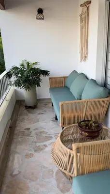 a living room with a couch and a table at Casa Laurel Hospedaje Boutique Alojamiento Completo in Medellín
