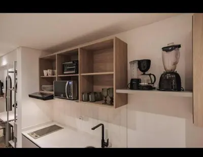a kitchen with a sink and a blender on a shelf at NEW Loft 38 mt in Laureles, AC, Internet, Jacuzzis, 1 Queen Bed & 1 sofabed in Medellín