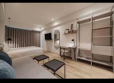 a bedroom with a bed and a desk with a mirror at NEW Loft 38 mt in Laureles, AC, Internet, Jacuzzis, 1 Queen Bed & 1 sofabed in Medellín