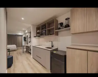 a kitchen with a sink and a counter top at NEW Loft 38 mt in Laureles, AC, Internet, Jacuzzis, 1 Queen Bed & 1 sofabed in Medellín