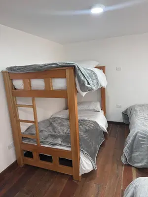 a couple of bunk beds in a room at Casa Campestre Los Nevados Patio Bonito in Estación El Salto