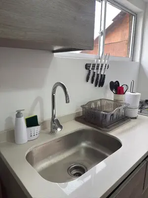 a stainless steel sink in a kitchen with a window at Casa Campestre Los Nevados Patio Bonito in Estación El Salto