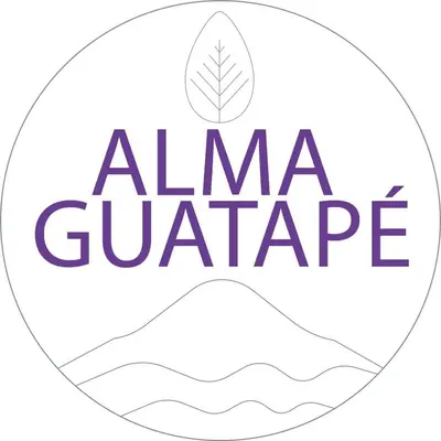 a logo for alma gutteroperative with a leaf in the middle at Alma Guatapé in Guatapé