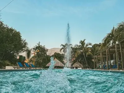 a person in the water in a pool with a fountain at Sky Natural Museum in Santa Fe de Antioquia