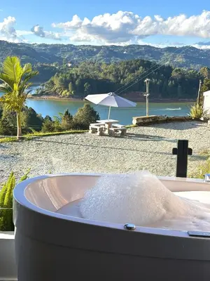 a bath tub filled with lots of water next to a beach at GUATAPE By MONTE GANDOLFO in Chiquinquirá