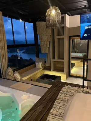a bathroom with a tub and a large window at MORITZ By MONTE GANDOLFO in Chiquinquirá