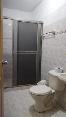 a bathroom with a shower and a toilet and a sink at Escapada Rural, Finca Espaciosa y Relajante en el Corazón de la Naturaleza in Sopetran