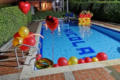 a swimming pool with balloons and balloons in the water at Escapada Rural, Finca Espaciosa y Relajante en el Corazón de la Naturaleza in Sopetran
