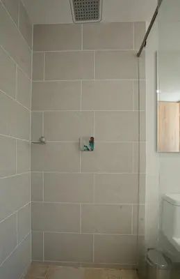 a bathroom with a shower with a glass door at Elegant apt in Laureles The best area in Medellin in Medellín