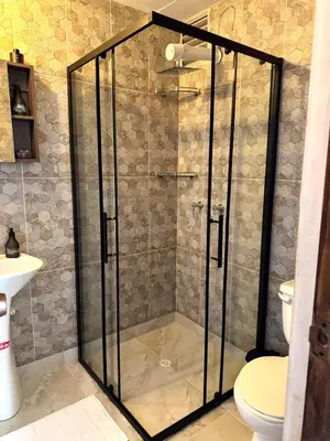 a shower with a glass door in a bathroom at Casa Macrame El Carmen de Viboral in Carmen de Viboral