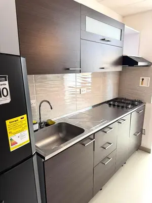 a kitchen with a sink and a refrigerator at Casa Macrame El Carmen de Viboral in Carmen de Viboral