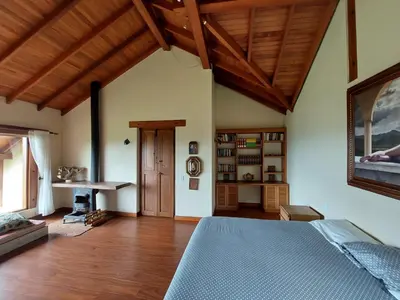 a bedroom with a bed and a wooden ceiling at Casa de Campo, La Suiza in La Ceja, Antioquia in La Ceja