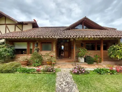 a house with a pathway leading to the front door at Casa de Campo, La Suiza in La Ceja, Antioquia in La Ceja