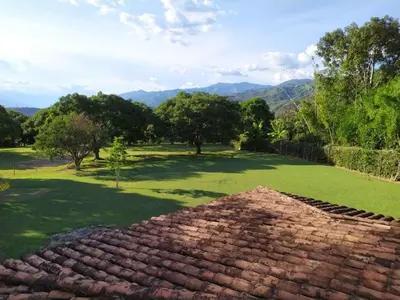a roof of a house with a view of a field at Finca Las Dos Palmas, San Jeronimo in San Jerónimo
