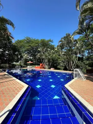 a large swimming pool with blue tiles on it at Finca Las Dos Palmas, San Jeronimo in San Jerónimo