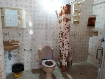 a bathroom with a toilet and a sink at Finca Las Dos Palmas, San Jeronimo in San Jerónimo