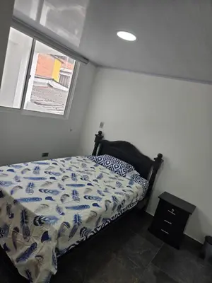 a bedroom with a bed and a window at Vancouver 102 in Villamaría