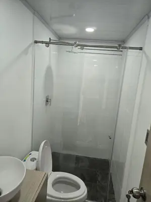 a bathroom with a shower and a toilet and a sink at Vancouver 102 in Villamaría
