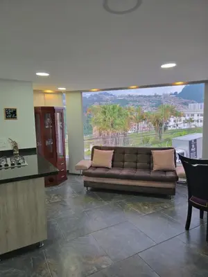 a living room with a couch and a view at Vancouver 201 in Villamaría