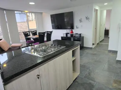 a kitchen with a stove top on a counter at Vancouver 201 in Villamaría
