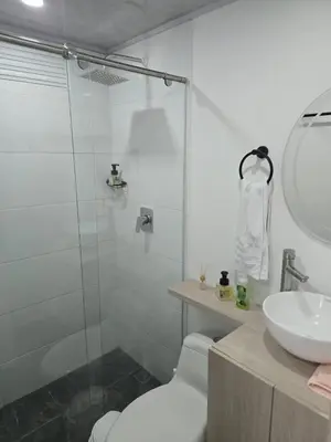 a bathroom with a shower and a toilet and a sink at Vancouver 201 in Villamaría