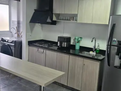 a kitchen with a stove and a counter top at Vancouver 402 in Villamaría