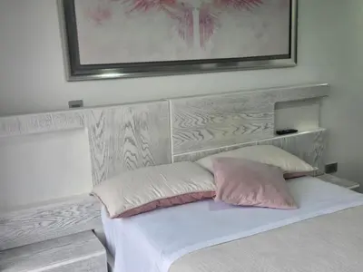 a bedroom with a bed with two pillows on it at Vancouver 402 in Villamaría