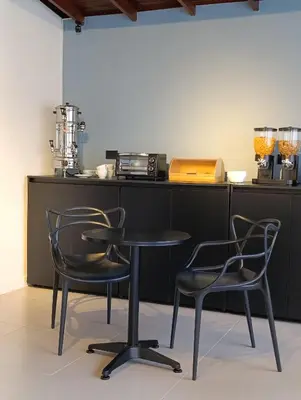 a table and two chairs in a kitchen at Bluelux Med - B&B in Medellín