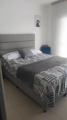 a large bed in a bedroom with at Central apartamento en la Estrella in La Estrella