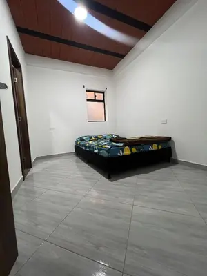a room with a bed in the middle of it at Casa Luagua in San Rafael