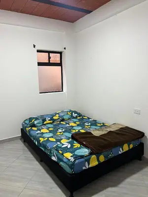 a bedroom with a bed in a room with a window at Casa Luagua in San Rafael