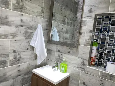a bathroom with a sink and a mirror at Coliving Belen Malibu in Medellín