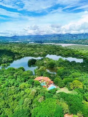 an aerial view of a house in the middle of a forest at Hostería Florida Tropical in Santa Fe de Antioquia