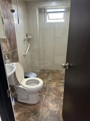 a bathroom with a toilet and a sink and a shower at Casa en Marinilla cerca a guatape y el peñol in Marinilla