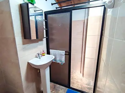 a bathroom with a sink and a shower at Acogedor apartamento cerca al tranvía 301 in Medellín
