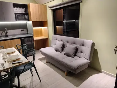 a living room with a couch and a table at Kristal Luxury - Guatapé in El Peñol