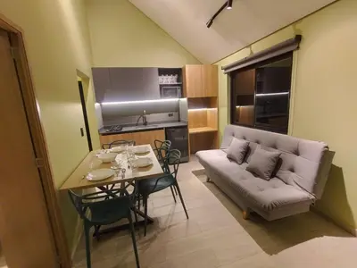a living room with a couch and a table at Kristal Luxury - Guatapé in El Peñol