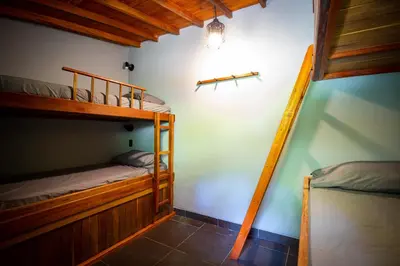 a room with two bunk beds in a house at Hermosa Casa y Cabañas en Barbosa, Antioquia in Barbosa