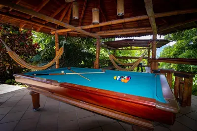 a pool table sitting on top of a patio at Hermosa Casa y Cabañas en Barbosa, Antioquia in Barbosa